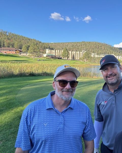 Steve on the golf course with a friend
